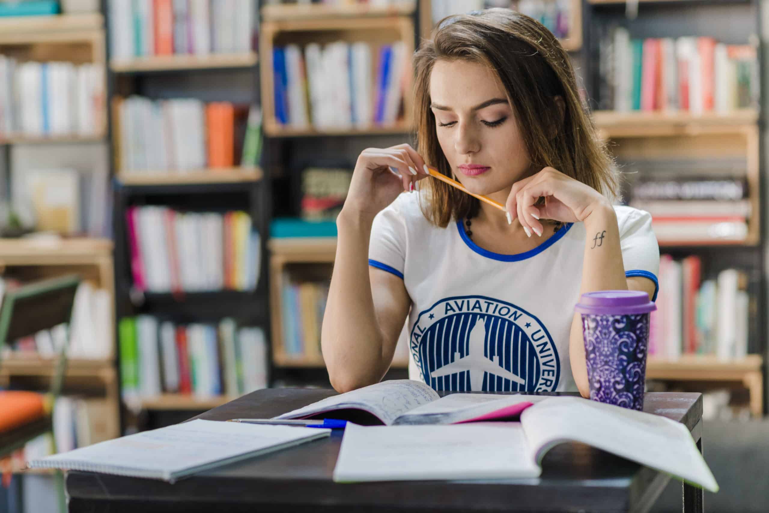 girl-sitting-table-with-notebooks